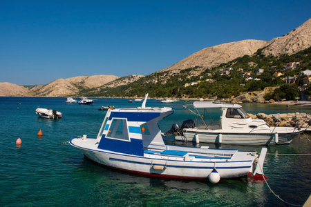 Boats moored at the coastal town of Stara Baska on Krk island in the Primorje-Gorski Kotar County of western Croatiaのeditorial素材