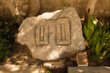 Baska, Croatia - 4th September 2021. Part of the Baska Valley Glagolitic Alphabet Trail, the oldest known Slavic alphabet dating from the 9th century. This representation of the letter T is located at Holy Trinity Parish Church in Baskaのeditorial素材