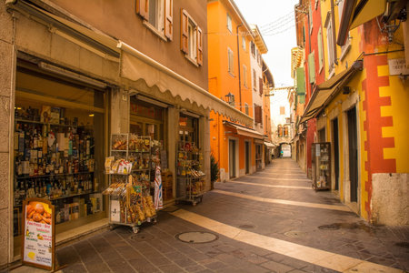 Garda, Italy - December 27th 2021. A quiet back street at Christmas in Garda town on the east shore of lake Garda, Verona Province, Veneto, north east Italyのeditorial素材