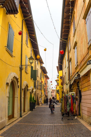 Torri del Benaco, Italy - December 27th 2021. Historic buildings at Christmas near the waterfront in Torri del Benaco at Lake Garda, in Verona Province, Veneto, north east Italyのeditorial素材