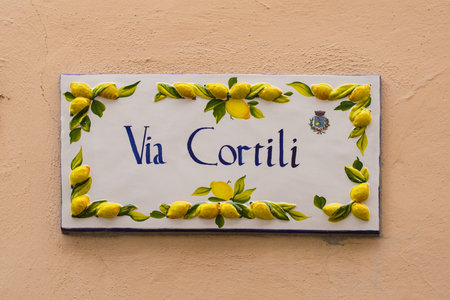 Limone sul Garda, Italy - December 24th 2021. The distinctive street signs in Limone sul Garda on the north east shore of Lake Garda, Brescia province, Lombardyのeditorial素材