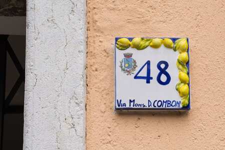 Limone sul Garda, Italy - December 24th 2021. The distinctive street signs in Limone sul Garda on the north east shore of Lake Garda, Brescia province, Lombardyのeditorial素材