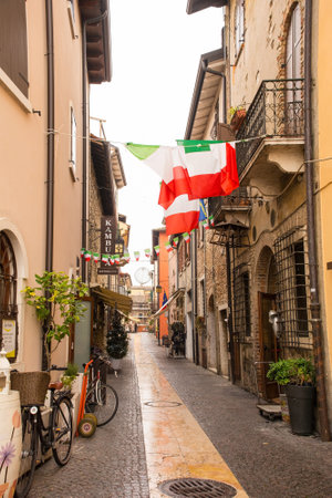 Lazise, Italy - December 27th 2021. A quiet back street in Lazise on the shore of lake Garda, Verona Province, Veneto, north east Italyのeditorial素材