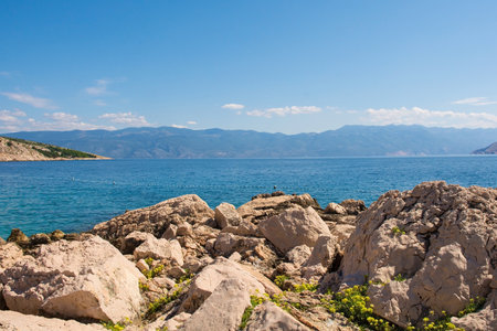 The coast south east of Baska in the south of Krk Island, in the Primorje-Gorski Kotar County of western Croatia in late summerの写真素材