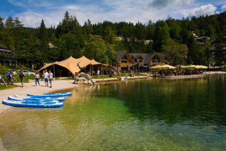 Kranjska Gora, Slovenia - August 21st 2022. Tourists spending time at Jasna Lake near Kranjska Gora in the Upper Carniola region of north west Slovenia. An artificial lake created for tourism purposesのeditorial素材