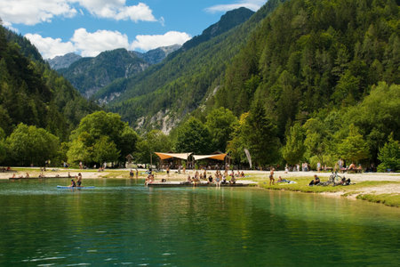 Kranjska Gora, Slovenia - August 21st 2022. Tourists spending time at Jasna Lake near Kranjska Gora in the Upper Carniola region of north west Slovenia. An artificial lake created for tourism purposesのeditorial素材