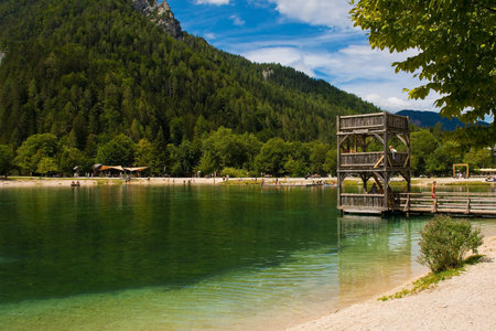 Kranjska Gora, Slovenia - August 21st 2022. Tourists spending time at Jasna Lake near Kranjska Gora in the Upper Carniola region of north west Slovenia. An artificial lake created for tourism purposesのeditorial素材