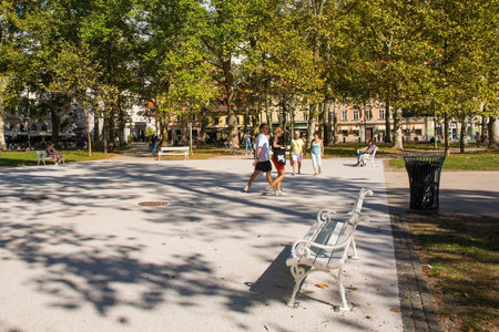 Ljubljana, Slovenia - September 4th 2022. Tourists and locals on a summer afternoon in Park Zvezda in the centre of Ljubljana, Sloveniaのeditorial素材