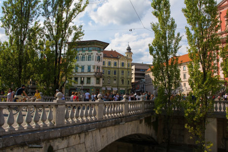 Ljubljana, Slovenia - September 3rd 2022. The Triple Bridge or Tromostovje over the Ljubljanici River in central Ljubljana. An historic group of 3 bridges made from granite, limestone and concreteのeditorial素材