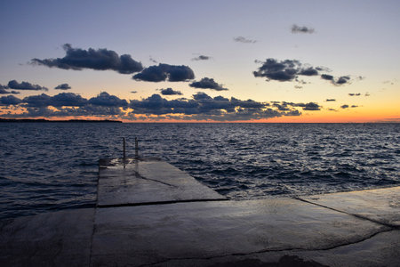 A beautiful sunset on the waterfront of Piran town in Slovenia in mid Septemberの写真素材
