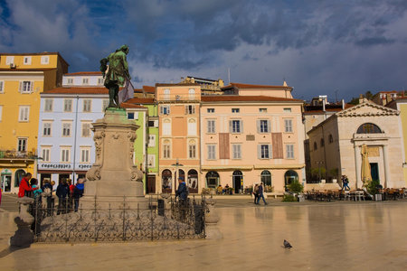 Piran, Slovenia - September 17th 2022. The historic Tartini Square, Tartinijev Trg, in the centre of old town Piran on the Slovenian coast. A Giuseppe Tartini statue foreground leftのeditorial素材