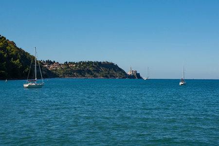 Strunjan protected marine park on the coast of Slovenia in the Gulf of Trieste, mid September. The historic medieval town of Piran can be seen background centreの写真素材