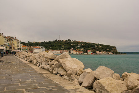 The waterfront of the historic medieval town of Piran on the coast of Sloveniaの写真素材