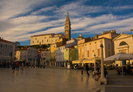 Piran, Slovenia - September 18th 2022. The historic Tartini Square, Tartinijev Trg, in the centre of old town Piran on the Slovenian coast. The belltower of St George's Parish Church is in the backgroundのeditorial素材