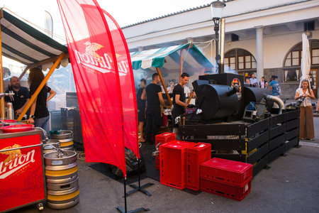 Ljubljana, Slovenia - September 3rd 2022. Cooks prepares barbecued meat at an outdoor street food market in Pogacarjev Trg in central Ljubljana, Sloveniaのeditorial素材