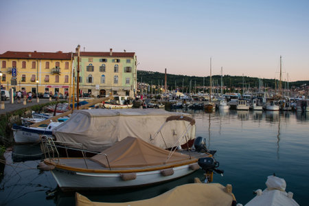 Izola, Slovenia - 8th July 2022. Dusk at the waterfront of the historic medieval town of Izola on the Adriatic coast of Sloveniaのeditorial素材