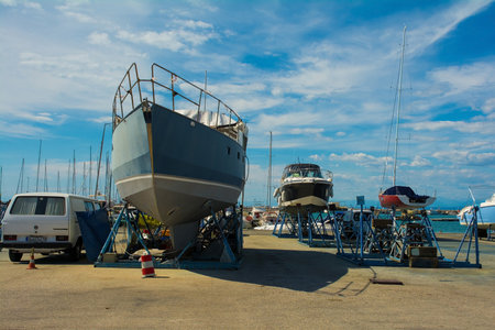 Izola, Slovenia - 9th July 2022. Leisure boats are repaired on boat cradles at Izola marina on Slovenia's Adriatic coastのeditorial素材