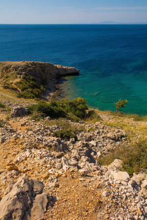 The rugged coastline north of Stara Baska in the south of Krk Island, in the Primorje-Gorski Kotar County of western Croatia in late summerの写真素材