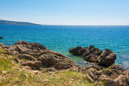 The rocky coastline near Krk Town on Krk Island in the Primorje-Gorski Kotar County of western Croatiaの写真素材