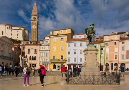 Piran, Slovenia - September 17th 2022. The historic Tartini Square, Tartinijev Trg, in the centre of old town Piran on the Slovenian coast. The belltower of St George's Parish Church is in the background and a Giuseppe Tartini statue foreground rightのeditorial素材