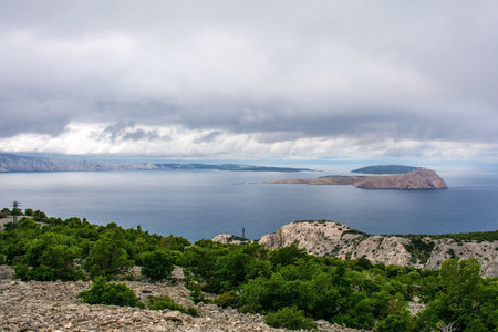 The Adriatic coast of Croatia near the town of Klada in Lika-Senj county, late spring. Looking towards Goli Otok island on the right with Otok Sveti Grgur behind it, and Rab island leftの写真素材