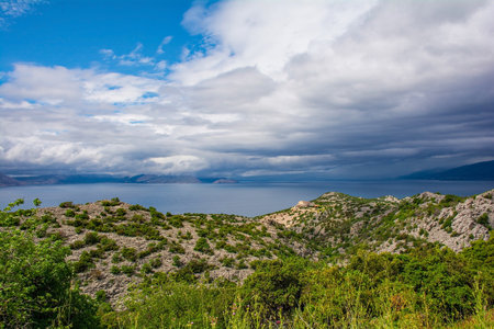 Storm clouds on the Adriatic coast of Croatia south of the village of Sveti Juraj in Lika-Senj county, late springの写真素材