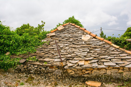 The slate roof of an historic abandoned residential building in the town of Nerezisca on Brac Island in Croatiaの写真素材