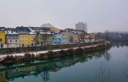 Christmas Eve on the Drava River viewed from the Draubrucke Bridge in the historical centre of Villach, Carinthia, Austriaのeditorial素材