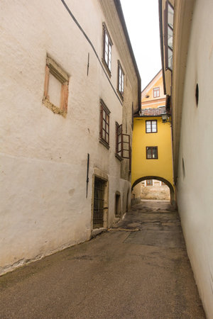 An arch spanning the medieval Blazeva Ulica street in the historic centre of Skofja Loka in Gorenjska, Sloveniaのeditorial素材