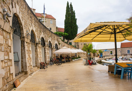 Bol, Croatia - May 15th 2023. The historic 19th century Loggia-Loza arcade on the waterfront of Bol town on Brac Island, Croatiaのeditorial素材
