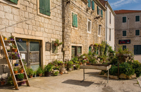 Kastela, Croatia - May 19th 2023. Old stone houses in the historic centre of Kastel Kambelovac in Kastela on the mainland of Croatiaのeditorial素材