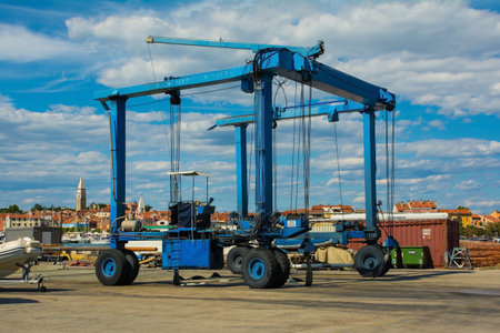 Izola, Slovenia - 9th July 2022. A mobile suspended boat lift or hoist at Izola marina on Slovenia's Adriatic coastのeditorial素材