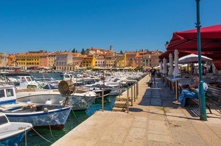 Rovinj, Croatia - July 9th 2023. Restaurants line the waterfront facing Rovinj old town in Istria, Croatiaのeditorial素材