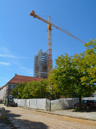 Karlovac, Croatia - September 1st 2023. Major renovation and road works underway in the historic centre of Karlovac. The Church of the Most Holy Trinity - Crkva Presveto Trojstvo - is seen covered in scaffolding in Trg Bana Josipa Jelacica squareのeditorial素材