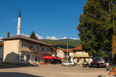 Kulen Vakuf, Bosnia - September 6th 2023. A square in the centre of Kulen Vakuf village in the Una National Park. Una-Sana Canton, Federation of Bosnia and Herzegovina. The minaret of Sultan Ahmedova Dzamija or Sultan Ahmed Mosque is in the backgroundのeditorial素材