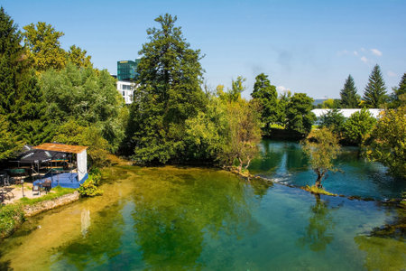 Bihac, Bosnia - September 7th 2023. A river side bar on the banks of the River Una as it passes through central Bihac in Una-Sana Canton, Federation of Bosnia and Herzegovina. Viewed from Most Alije Izetbegovica Bridgeのeditorial素材