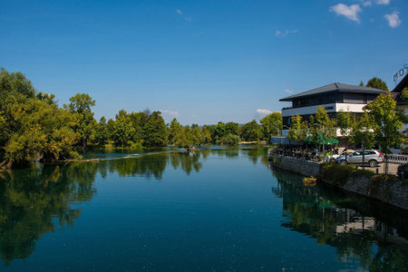 Bihac, Bosnia - September 7th 2023. The River Una as it passes through central Bihac in Una-Sana Canton, Federation of Bosnia and Herzegovina. Viewed from Smaragdni Most bridgeのeditorial素材