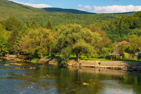 The River Una as it passes through Kulen Vakuf village in the Una National Park. Una-Sana Canton, Federation of Bosnia and Herzegovina. Early Septemberの写真素材