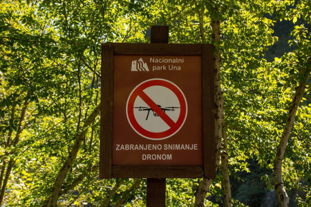 Bihac, Bosnia - September 8th 2023. A sign warns visitors to the Una National Park that filming from drones is not allowed in the area. Una-Sana Canton, Federation of Bosnia and Herzegovinaのeditorial素材