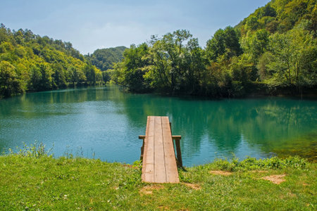 A wooden diving board on the River Una near Orasac, Bihac, in the Una National Park. Una-Sana Canton, Federation of Bosnia and Herzegovina. Early Septemberの写真素材