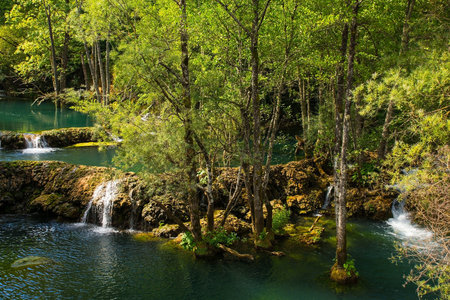 Travertine pools in the River Una at the Small Waterfalls at Martin Brod in Una-Sana Canton, Federation of Bosnia and Herzegovina. Located within the Una National Park. Early Septemberの写真素材