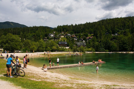 Kranjska Gora, Slovenia - August 21st 2022. Tourists spending time at Jasna Lake near Kranjska Gora in the Upper Carniola region of north west Slovenia. An artificial lake created for tourism purposesのeditorial素材
