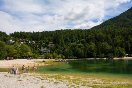Kranjska Gora, Slovenia - August 21st 2022. Tourists spending time at Jasna Lake near Kranjska Gora in the Upper Carniola region of north west Slovenia. An artificial lake created for tourism purposesのeditorial素材