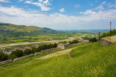 A view of the landscape from Berat Castle, Albania. The Osum river passes between Velabisht and Starove villages and the Shpirag Mountain Range in the background, and the more modern part of Berat in the foregroundの写真素材