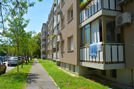 Mid rise modernist apartment blocks in Nova Gorica, Slovenia. Built 1960s-1980s with a functional and utilitarian design, they are typical of socialist-era post-WWII housing developments in the regionの写真素材