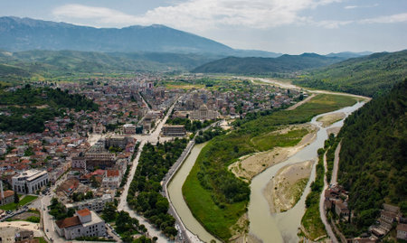 A view of the Lagja 30 Vjetori quarter of Berat in Albania taken from Berat Castle, with the Osum River right. This is the more modern, post-war part of the historic UNESCO listed townの写真素材