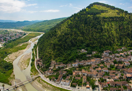 A view of the Gorica quarter of Berat in Albania taken from Berat Castle. Berat is UNESCO listed and is known as City of a Thousand Windows. On the right is Mali Partizan Mountain, with the Osum River left and Lagja 30 Vjetori district background leftの写真素材