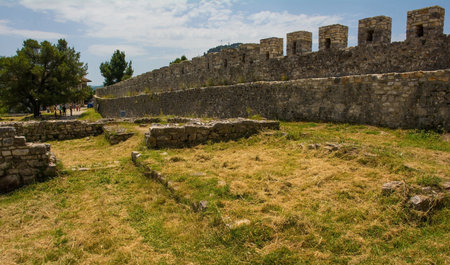 The base of the ruins of the 14th century Red Mosque within the fortified Berat Castle, southern Albania, showing the rectangular layout. The castle gallery wall is right. The castle is a blend of Byzantine, Ottoman and medieval Albanian architectural influences, it is located on Kalaja Hill overlooking Berat and the Osum River.の写真素材