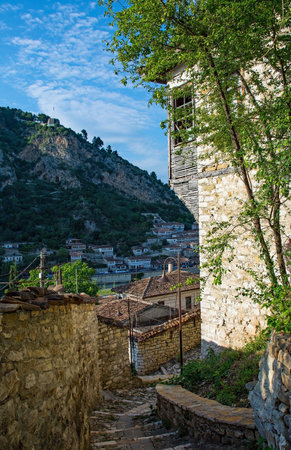 A house with half-timbered jettying on a cobbled stepped lane in the Gorica quarter of Berat in Albania, overlooking the Mangalem and Kaljala quarters. Berat is a UNESCO World Heritage Site and is known as City of a Thousand Windows. It is famous for its traditional Ottoman architectureの写真素材