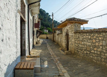 A cobbled lane in the historic Gorica quarter of Berat in Albania. Berat is a UNESCO World Heritage Site and is known as City of a Thousand Windows. It is famous for its traditional Ottoman architectureの写真素材